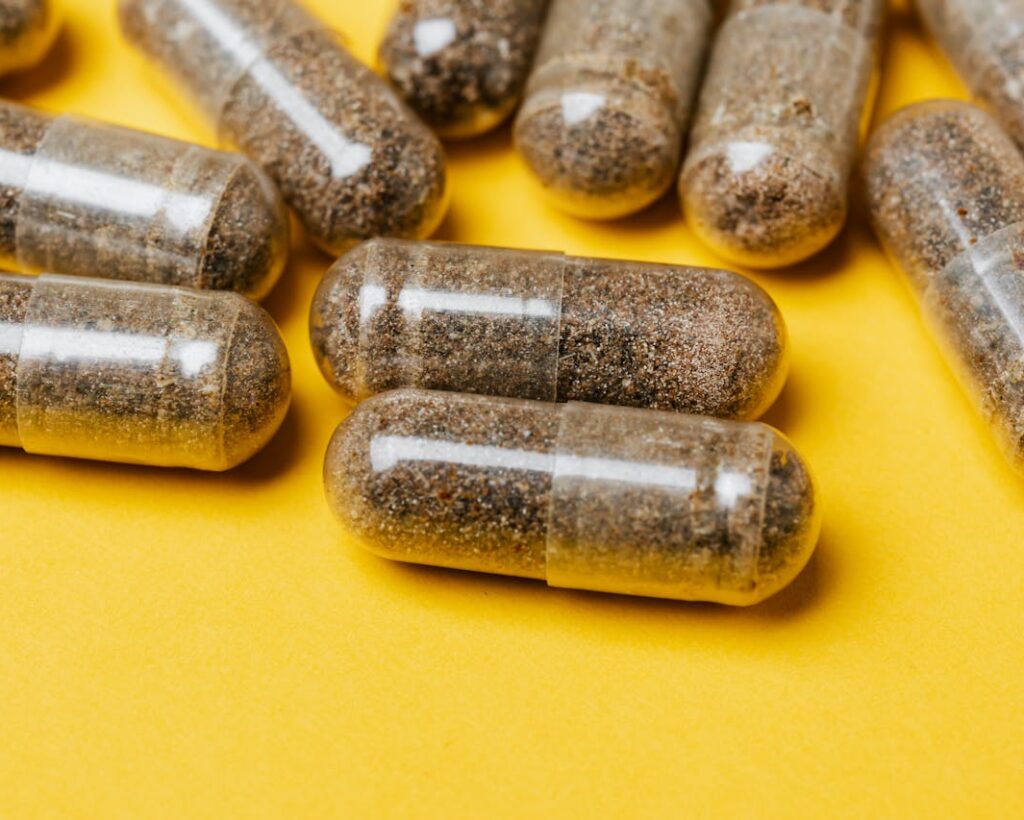 Capsules on Yellow Surface